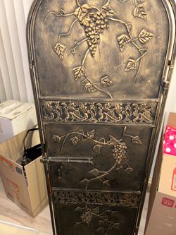 Bronze Tuscan-style wine rack.