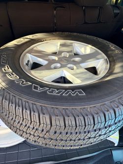 Never used Goodyear Wrangler Tire  & 5 - 17 in. Silver Aluminum wheels