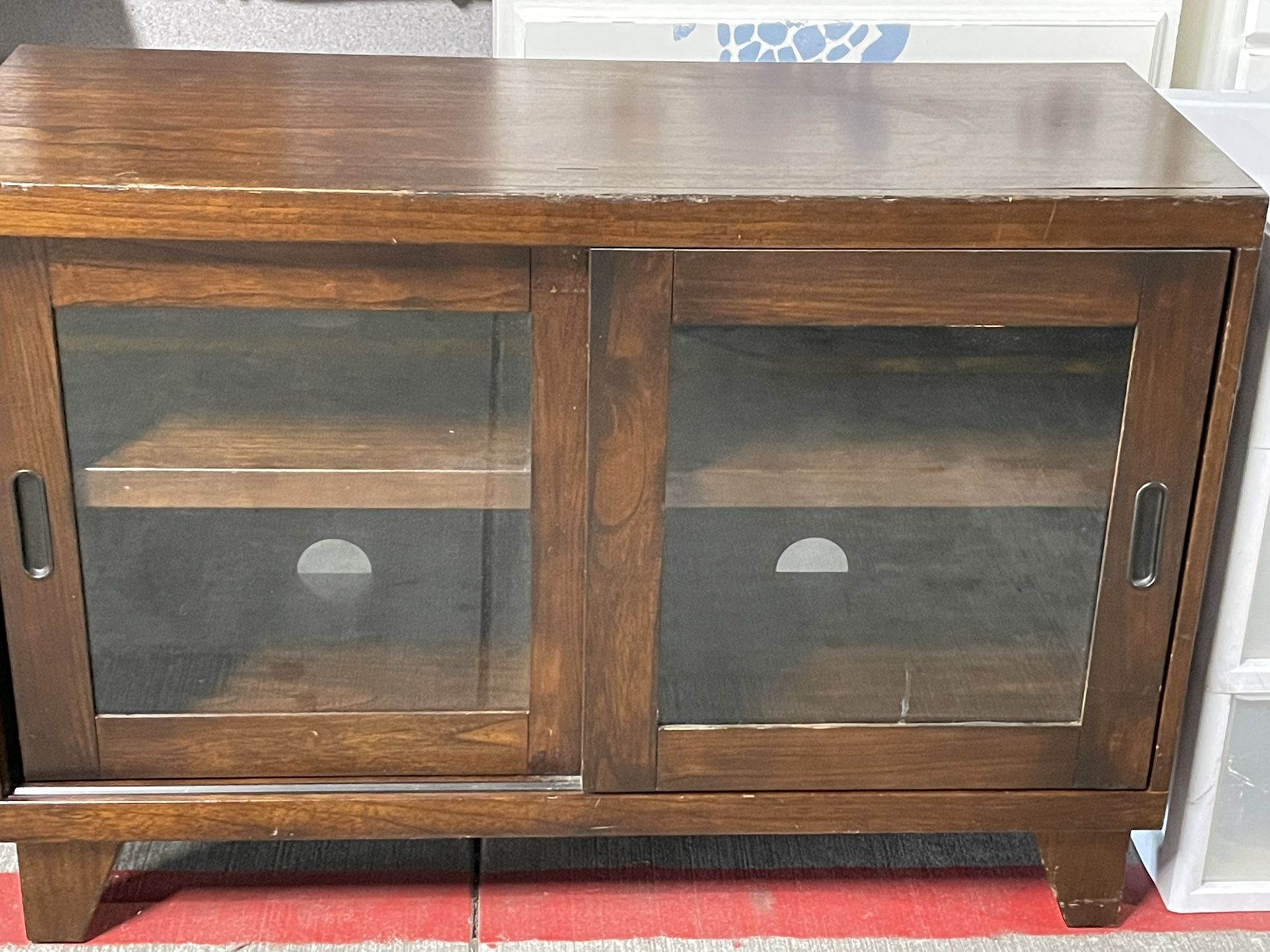 42” Wood Cabinet With shelves And Two  sliding glass doors