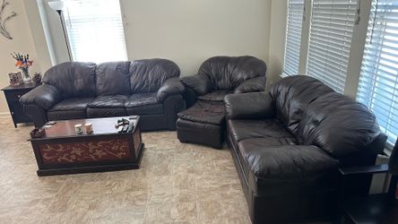 3 piece leather couch set with ottoman.