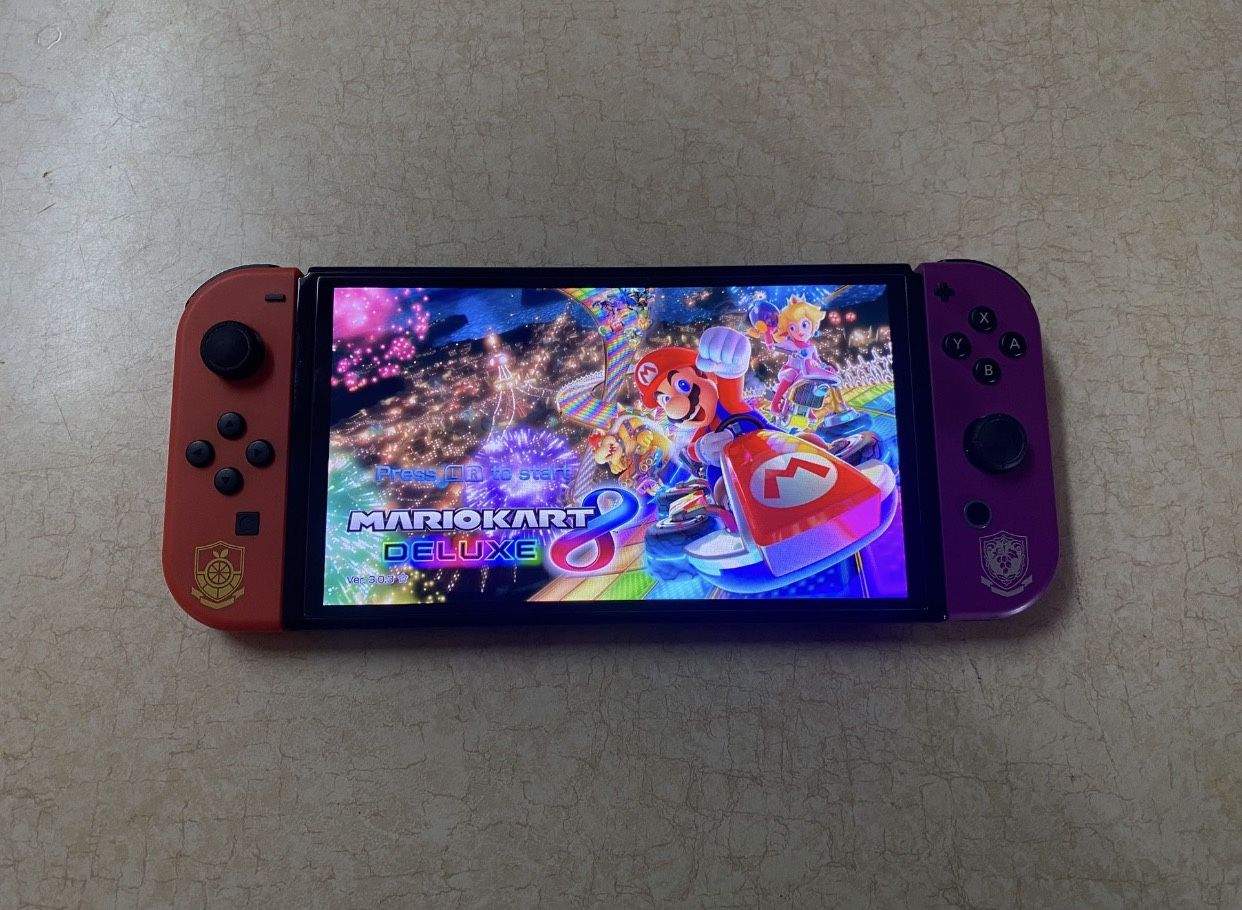 NINTENDO SWITCH OLED POKEMON EDITION + 125 SWITCH GAMES