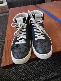 Coach high top sneakers. Signature C jacquard upper in black. Off White laces and off white rubber soles. Clean, stylish design. Great for casual wear