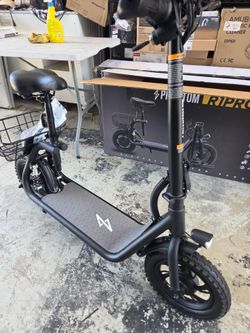 Phantom R1 Pro is a seated electric scooter 500W motor, 15.5 MPH top speed, 20-mile range. It includes 12-inch tires, a rear basket, a foldable frame