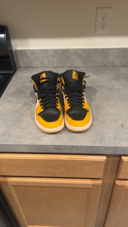 Yellow and black Jordan’s 1’s