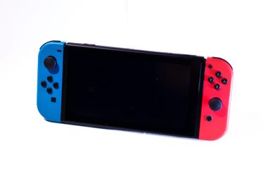 Nintendo Switch with Neon Blue and Red Joy-Cons