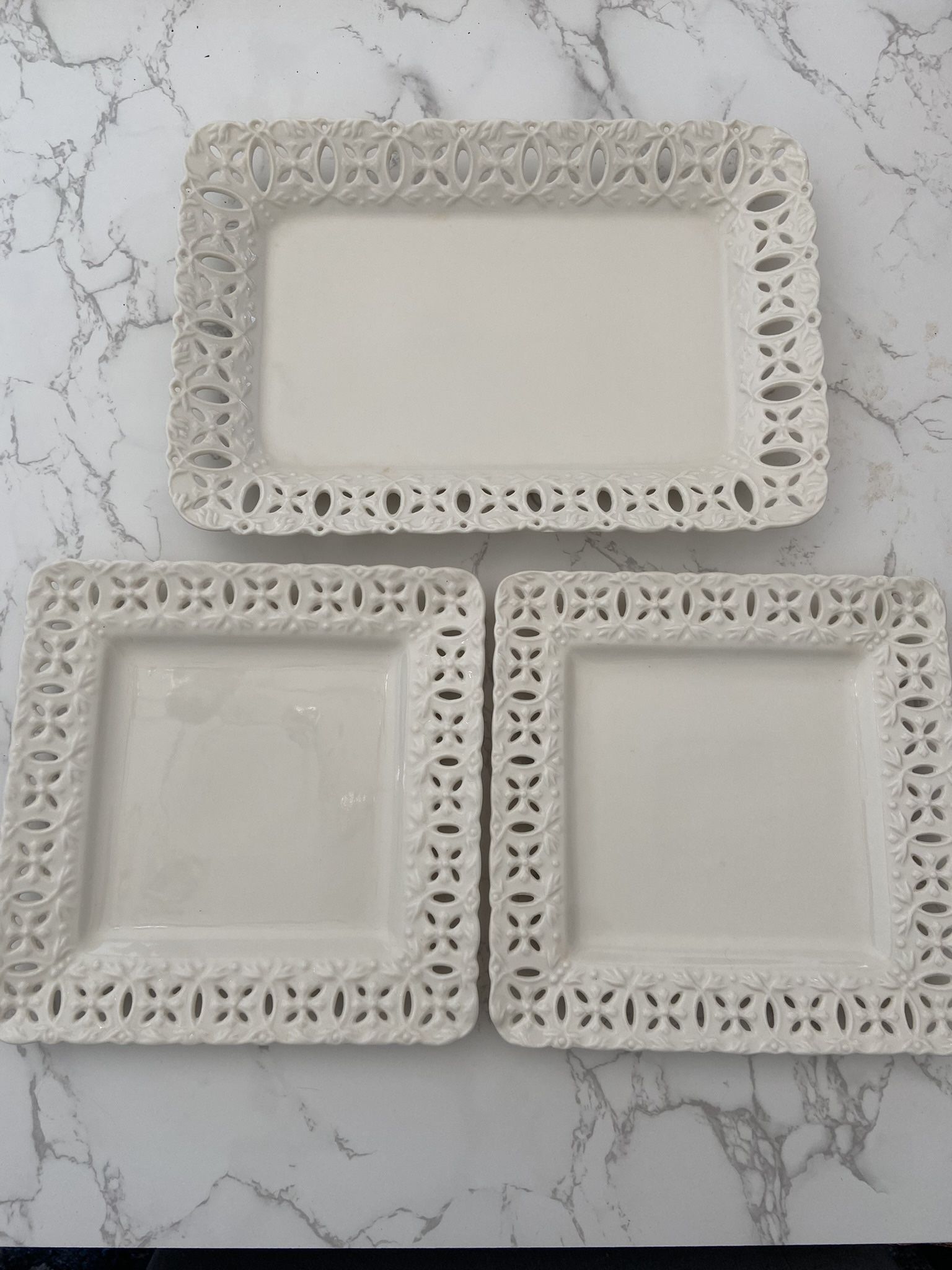 Set of porcelain serving dishes by Godinger & Co., featuring a vintage lace-edged Design