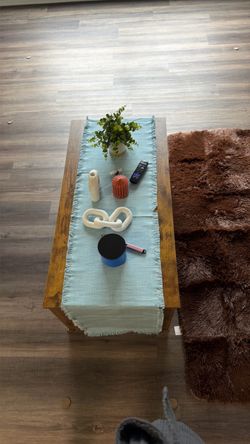 Small brown coffee table with storage underneath top turn into a table top