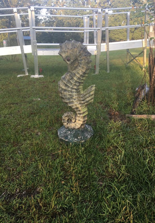 concrete seahorse statue