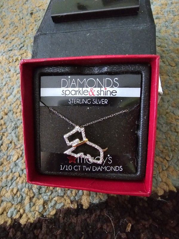 $20.  Macy's dog necklace.  Sterling silver accented with 1/10 CT TW diamonds.