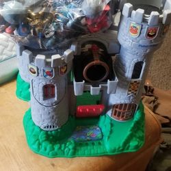 Fisher price castle and warriors With 27 Guys  And Three  Horses ate rocks to shoot from The  Launcher