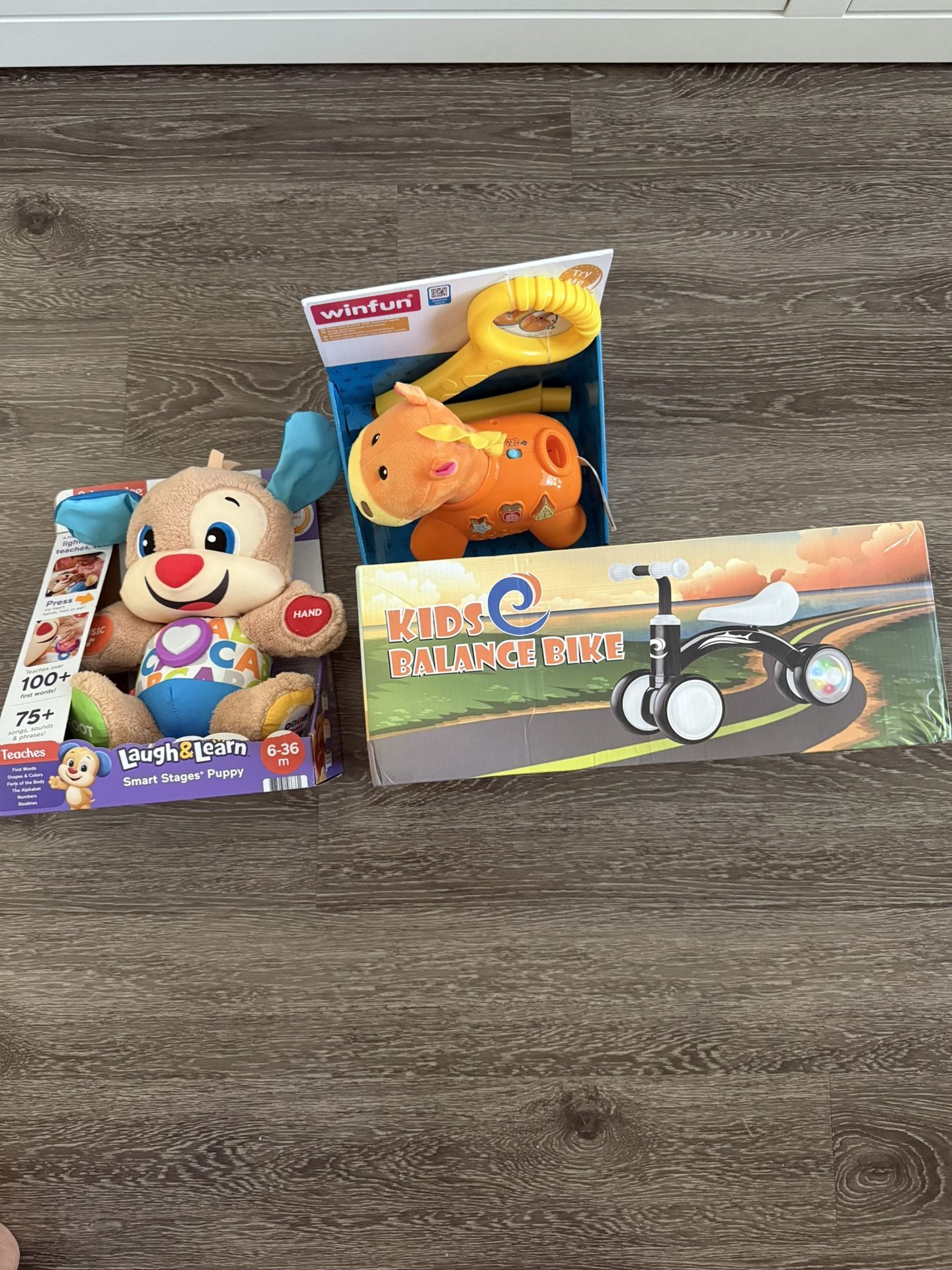 Fisher Price Laugh & Learn baby Toy, Kids Balance Bike , Win fun Walking Encouragement Toy 