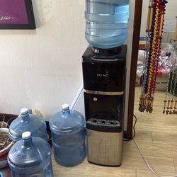 Water cooler w/ 4 bottles.