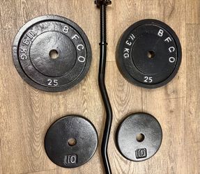 BRAND NEW: Standard Black Curl Bar with Cast Iron Weight Plates of 25s, 10s and 5 lbs. Total= 94 lbs