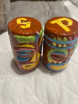 Tiki salt and pepper shakers with colorful tiki mask design approx 3.5”x2”
