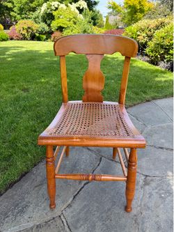 Antique straight back cane chair