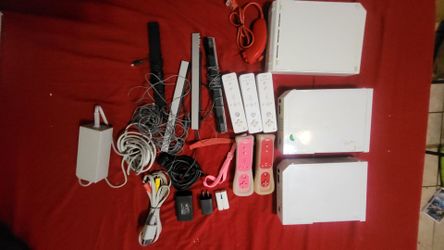 Various Wii Consoles, Controllers, Games, and Accessories
