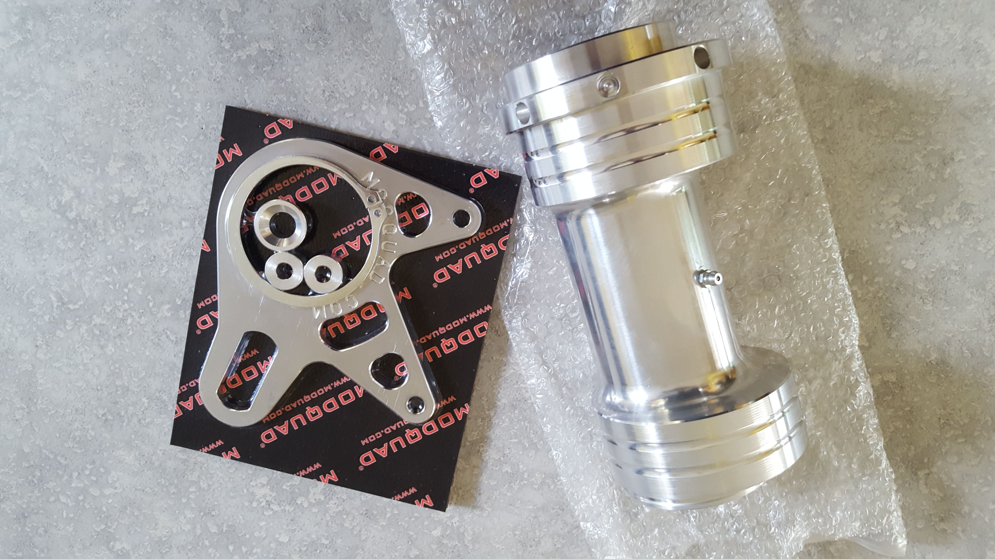 New Banshee billet carrier and brake stay for sale