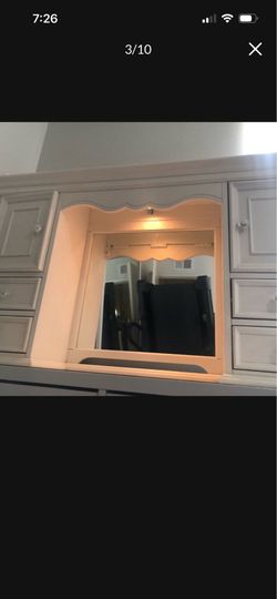 Vanity with lighted mirror
