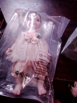 Porcelain Baby Doll in White Dress