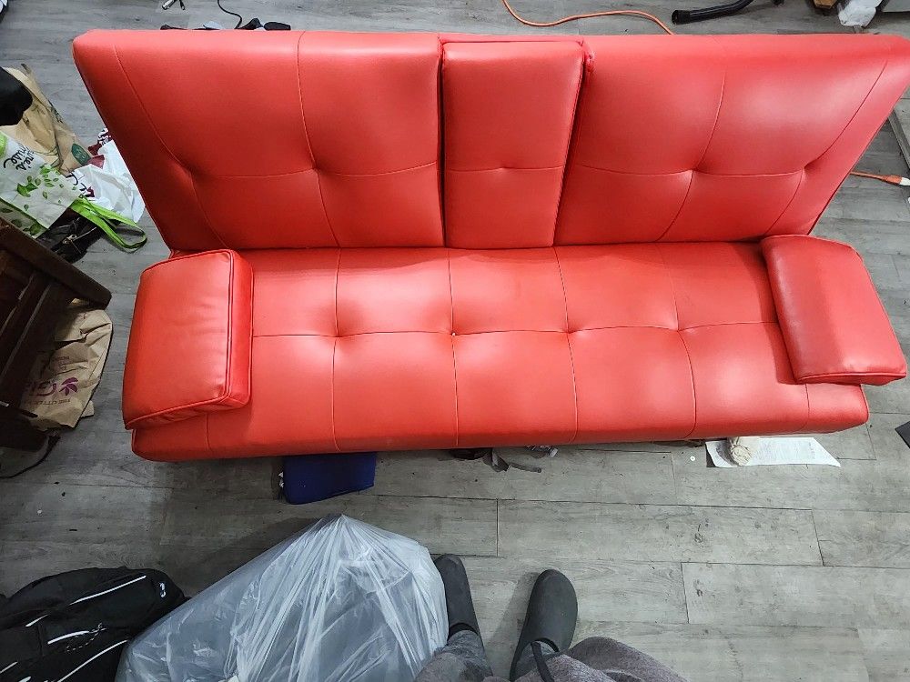 Red Lounge Couch Adjust ( The Back Part To Lay It Flat Like A Bed)