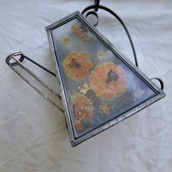 Decorative watering can with pressed flowers decor tea light