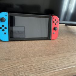 Nintendo Switch with Neon Blue and Neon Red Joy-Con