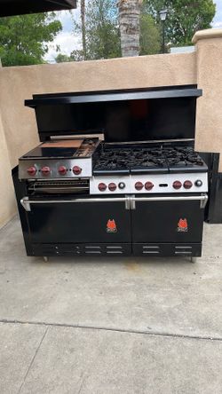 Commercial wolf six burner double convection ovens and griddle