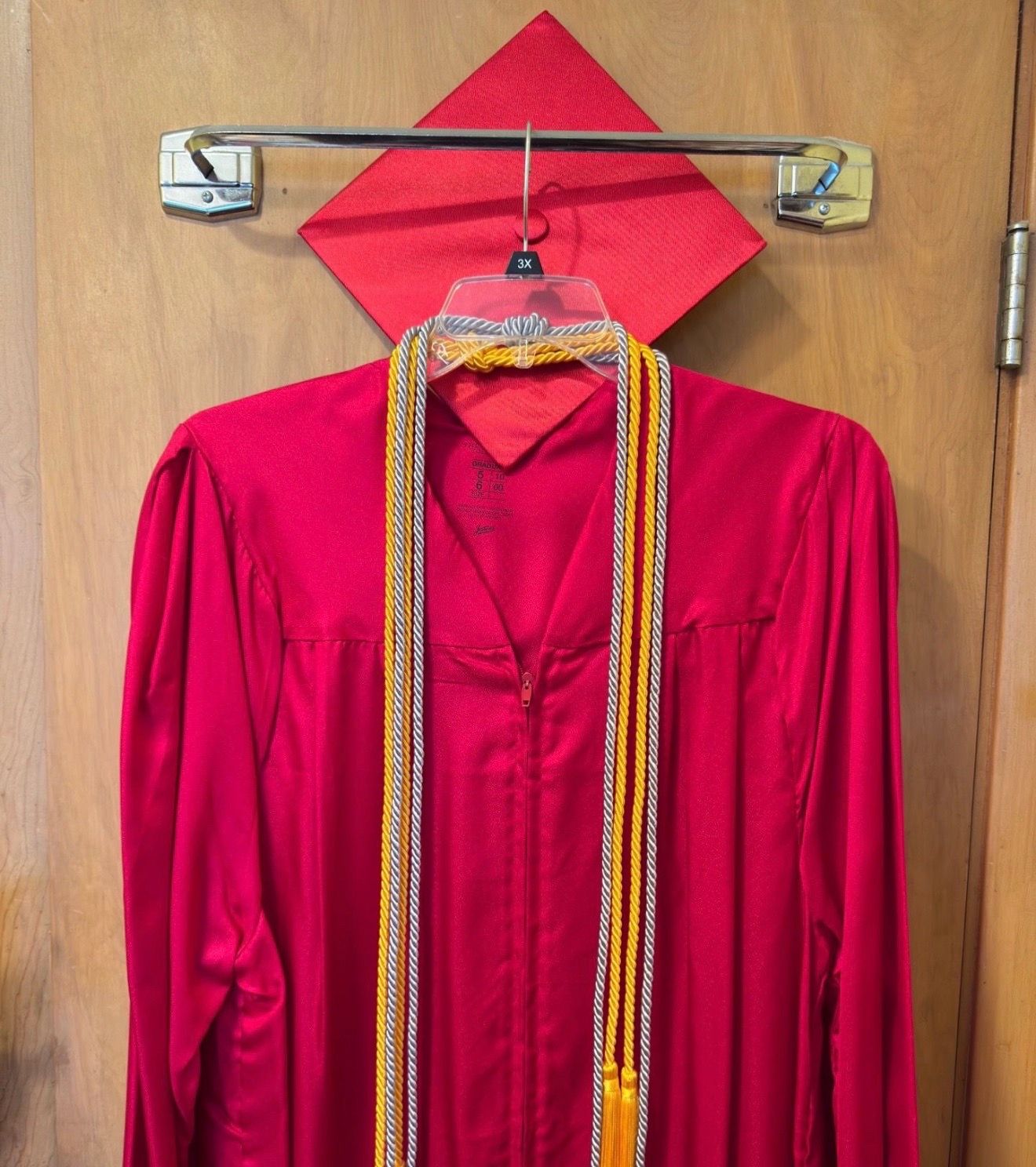Red cap and gown.