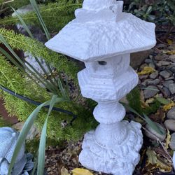 Small upright Asian cement pagoda