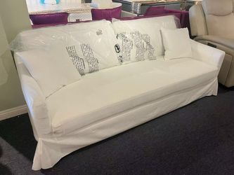 White Slipcovered Sofa with Throw Pillows，$260