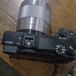 Sony Alpha 6100 mirrorless camera with a Sony E 1.8/50 OSS lens attached