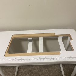 Features a sewing machine Table 