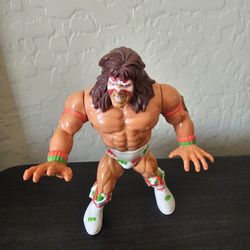 Series 1 Ultimate Warrior action figure from the WWF Hasbro line, known for its "Real Wrestling Action" figures produced from 1(contact info removed).