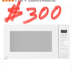  Ring Hay movimiento en tu Front GE Profile 2.2 cu. ft. 1100-Watt Countertop Microwave in White with Built -In Sensor