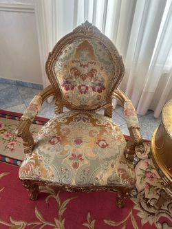 Pair of gold floral accent chairs