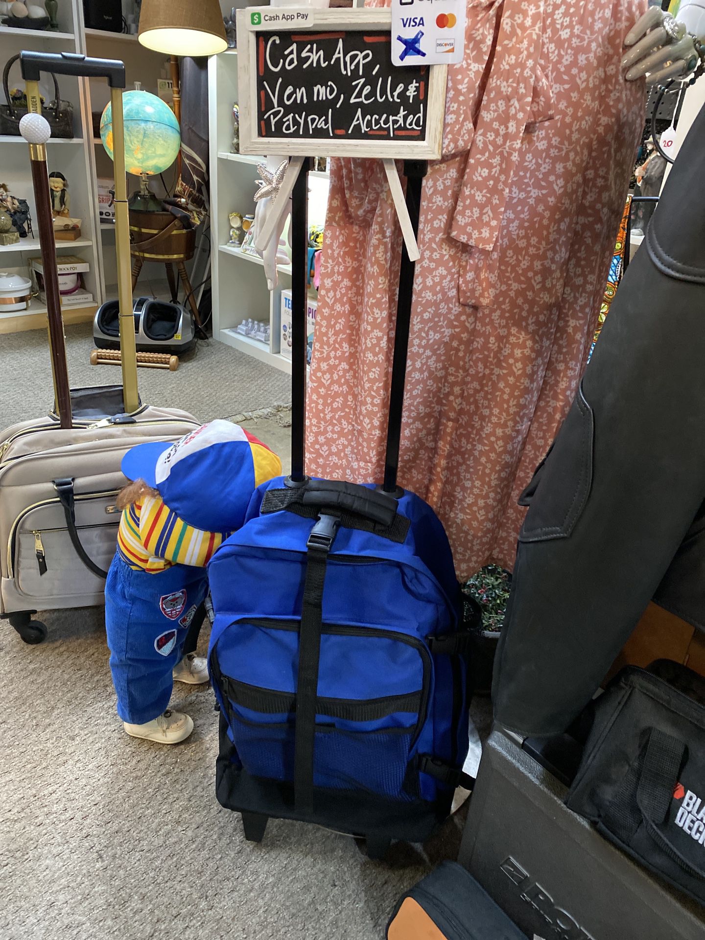 Blue and Black Rolling Luggage Backpack