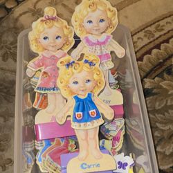 set of T.S. Shure Teeny Tiny Triplets Wooden Magnetic Dress-Up Dolls. 