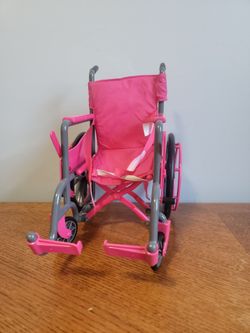 This pink and grey doll wheelchair is designed for an 18-inch figure