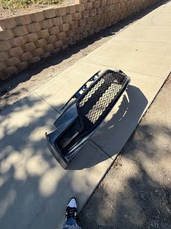 Toyota Corolla front bumper with grille OEM 2020-24