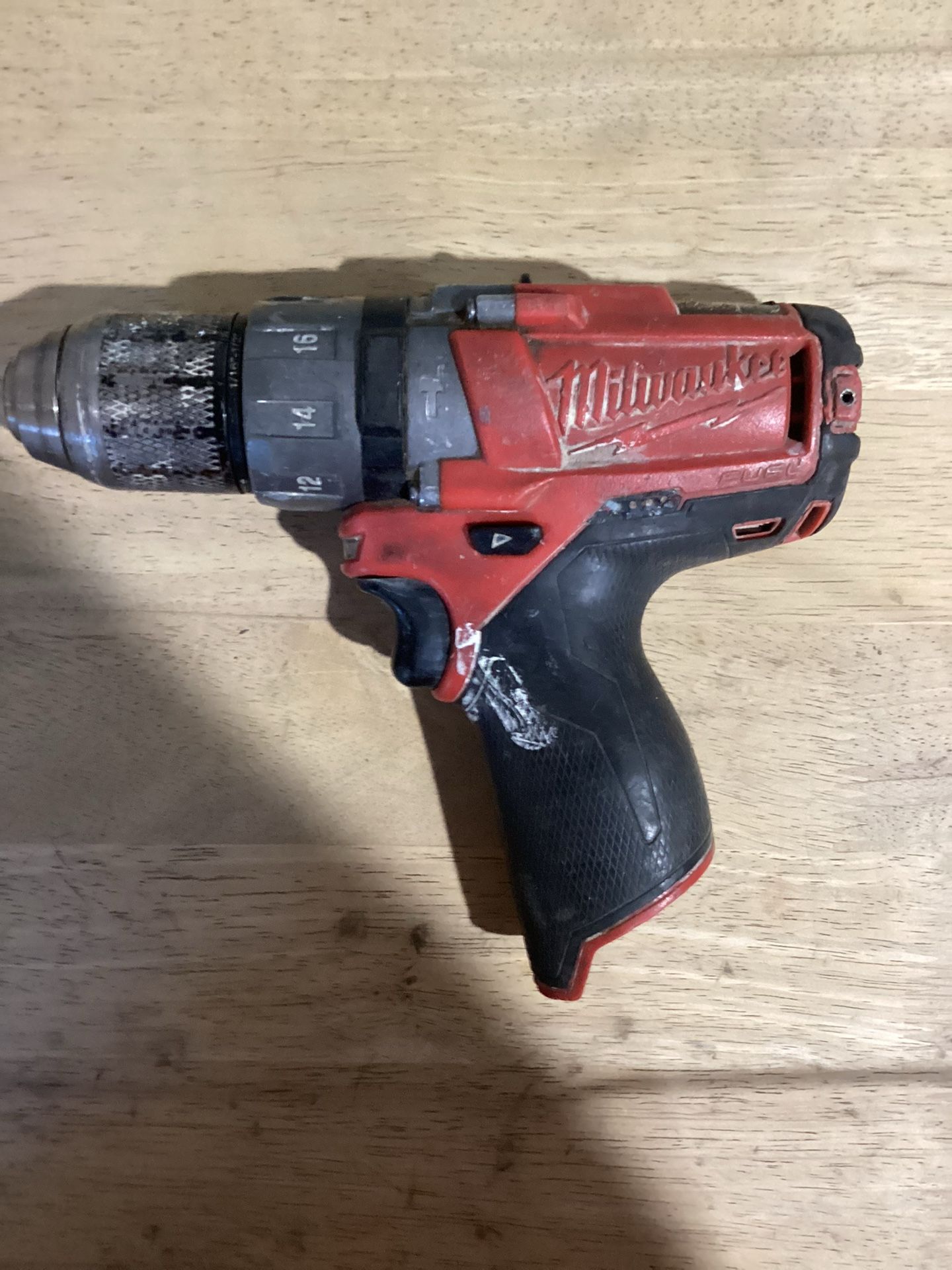 This is a Milwaukee M12 FUEL Hammer Drill. The tool shown in the image is a compact, cordless hammer drill that is part of the Milwaukee M12 battery s