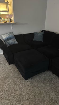 Blue couch with storage underneath