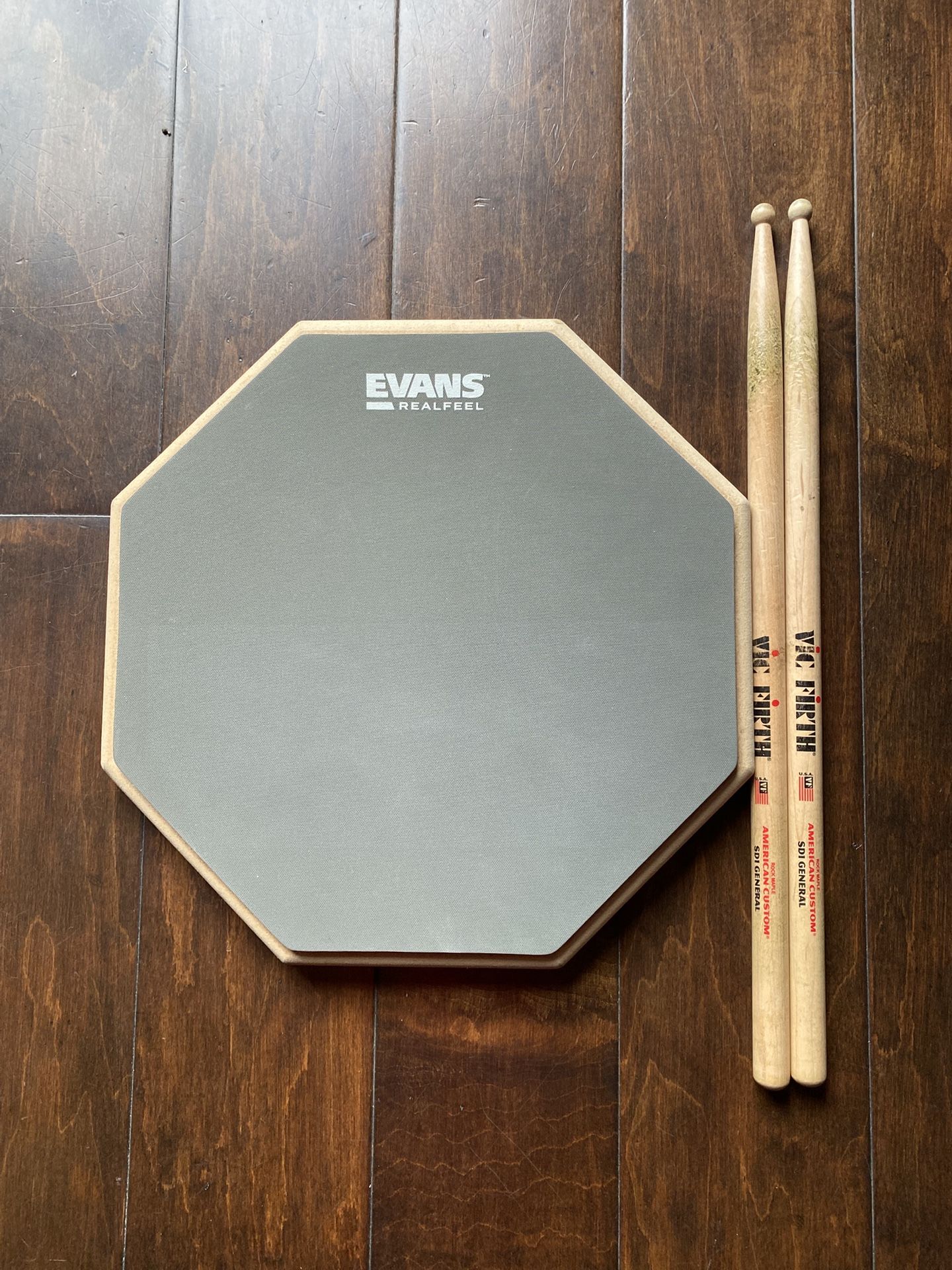 Evan’s Realfeel Drum Pad And Drum Sticks