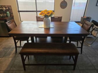 Counter height storage table with 4 chairs and bench