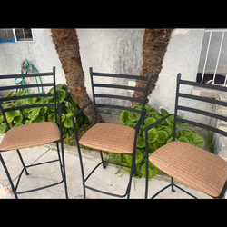 3 balck metal bar stools woven seats