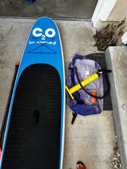 Inflatable stand-up paddleboard with pump