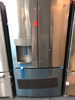 New scratch and dent GE stainless steel French door fridge. 1 year warranty
