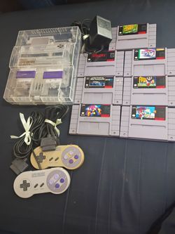 Super Nintendo 7 games 2 controllers.