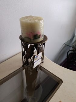 Iron candle holder/w candle. Never used