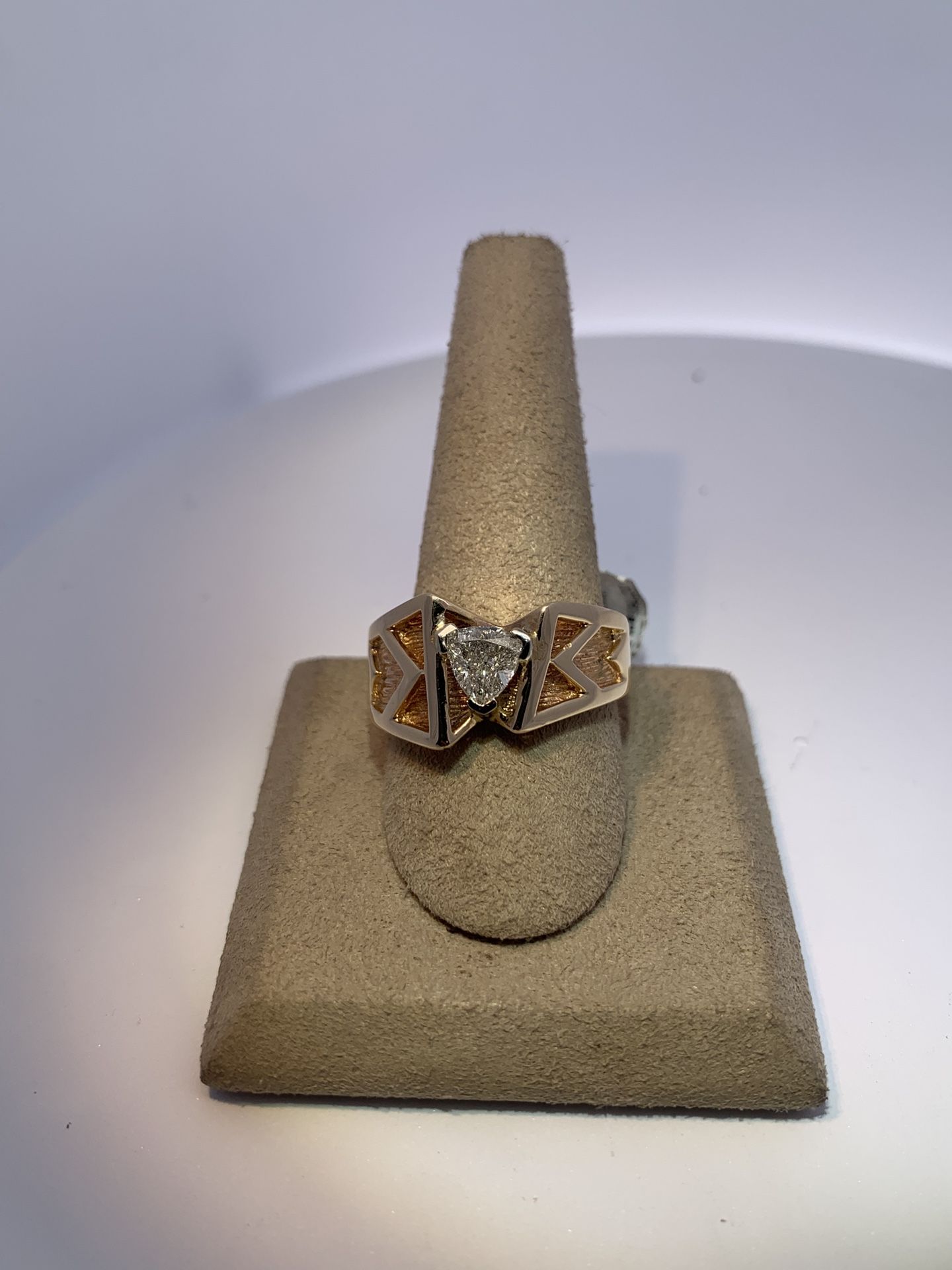 14K yellow gold estate gents ring with a 1.00 Carat Trilliant center diamond