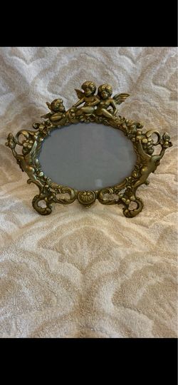 Vintage Cast Iron and Gilt Cherub Frame